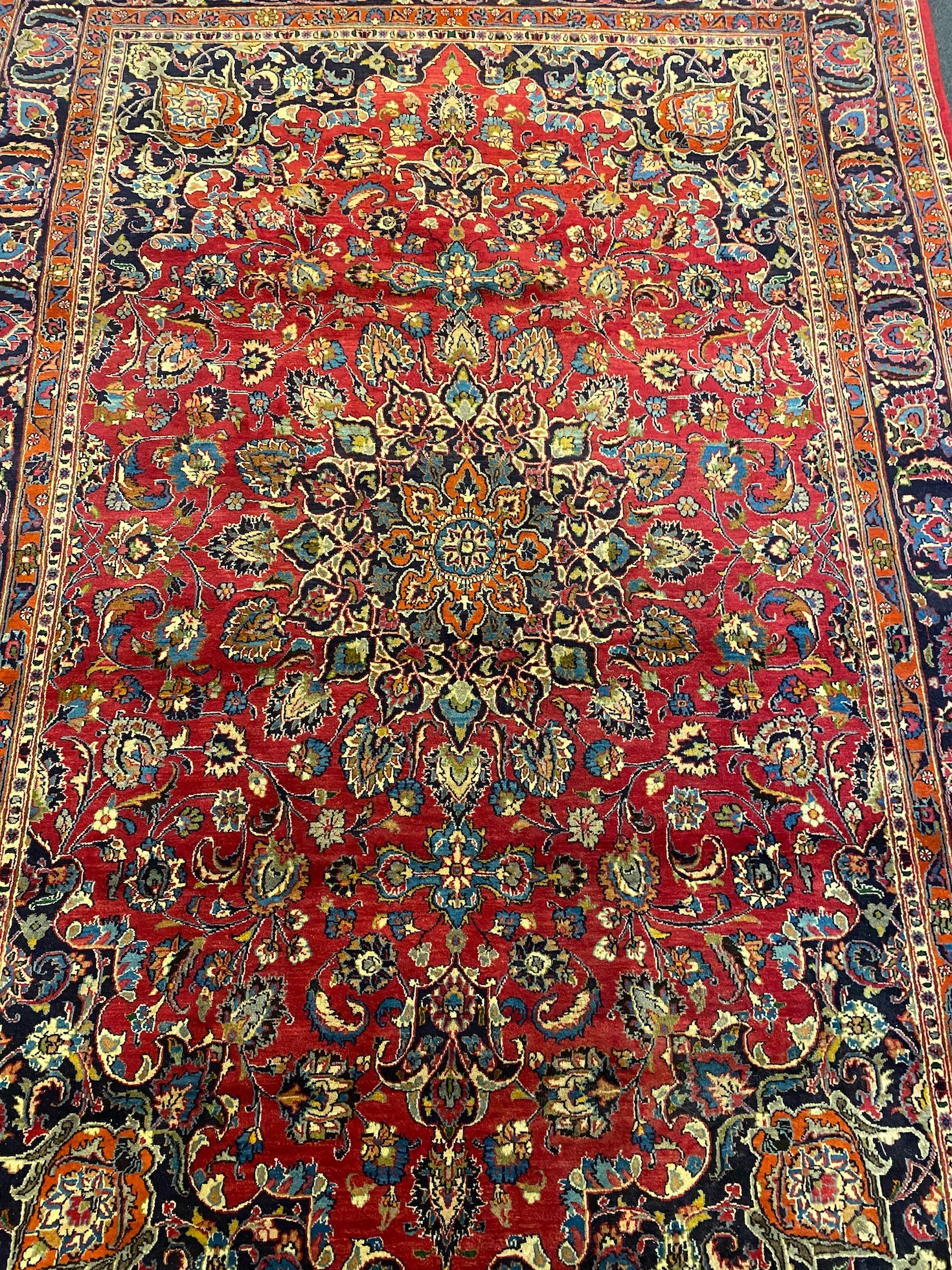 A Kashan claret ground carpet, 375cm x 250cm